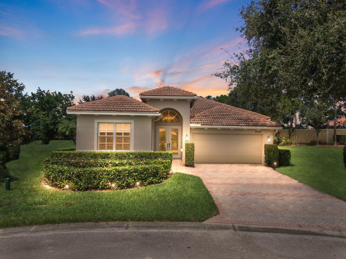 Located on one of the largest lots in The Lakes at PGA Village, this 3BR/2BA CBS pool home offers over 2,100asqaft of open living with upgrades throughout. The kitchen features soft-close cabinets, granite counters, stainless appliances, wine cooler, and dry bar. Enjoy a spacious primary suite with dual vanities, soaking tub, and walk-in shower. Outside, a screened lanai with covered patio surrounds a large pool and spa, perfect for relaxing or entertaining. Enjoy access to community amenities including tennis, clubhouse, fitness center, and more. Conveniently located near I-95, Clover Park, Tradition, dining, golf, and shopping.