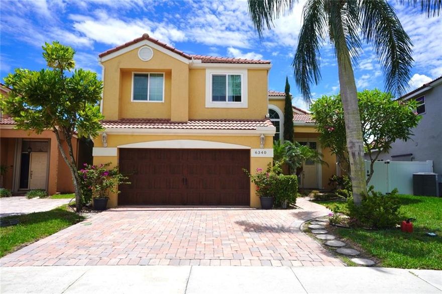 Amazing 4 bedroom 3 bath home situated on a serene lake, peaceful, family oriented, desirable community in Parkland. Large new kitchen, wood cabinets, quartz countertop and stainless steel appliances ideal for entertaining.  Large master bedroom.  Full bath on first floor. Hurricane impact windows, impact rated front door and impact rated garage door.  Great location near A+ rated schools, dining and shopping nearby.