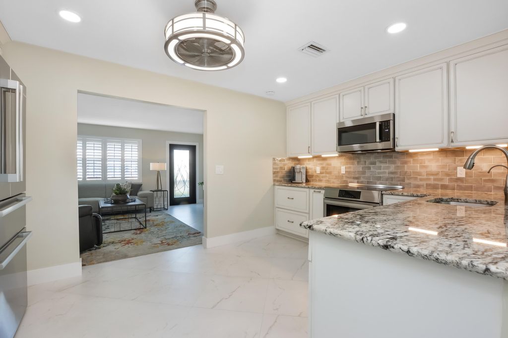 Photo of 2390 SW 13th Avenue, Boynton Beach, FL 33426 (MLS # R11150028)