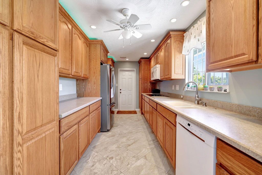 Photo of 1659 NE 23rd Terrace, Jensen Beach, FL 34957 (MLS # R10991515)