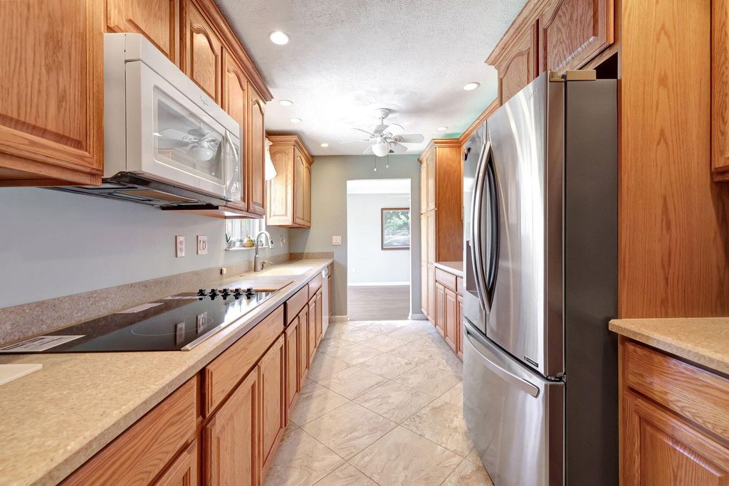 Photo of 1659 NE 23rd Terrace, Jensen Beach, FL 34957 (MLS # R10991515)