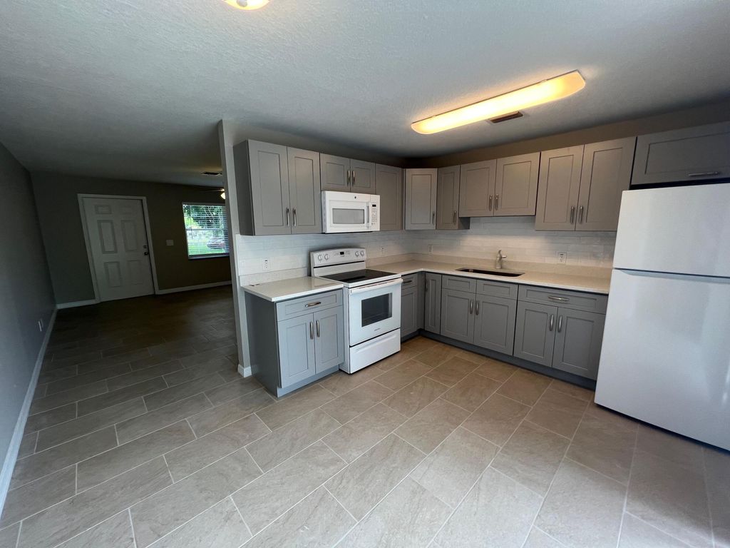 Photo of 1887 Breezy Lane, West Palm Beach, FL 33417 (MLS # B26045707)