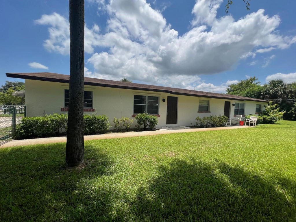 Photo of 1887 Breezy Lane, West Palm Beach, FL 33417 (MLS # B26045707)