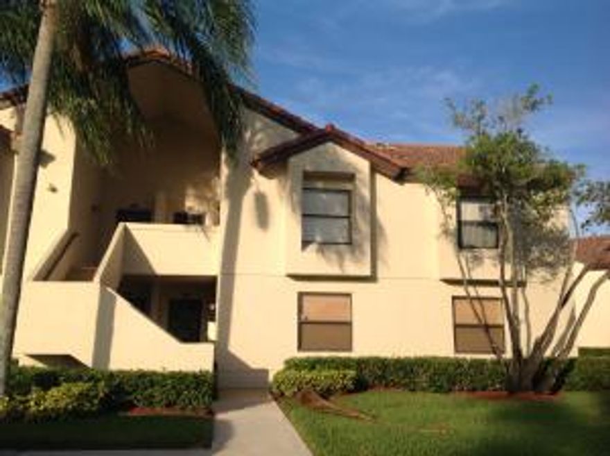 Come make this Beautiful Corner, upper floor your new home.  Tiled thru out, Garden views from all rooms.  This is shown as 2 bedroom, tax rolls show this as a 3 bedroom condo. Pet friendly allowing 1 pet up to 40 lbs. This Condo is very private and bright. View of Golf Course from kitchen and Patio. Full size Washer Dryer in condo. Great sought after community. Come fall in love with your new S. Fl Condo. Just a short walk to pool, great walking area thru out community.