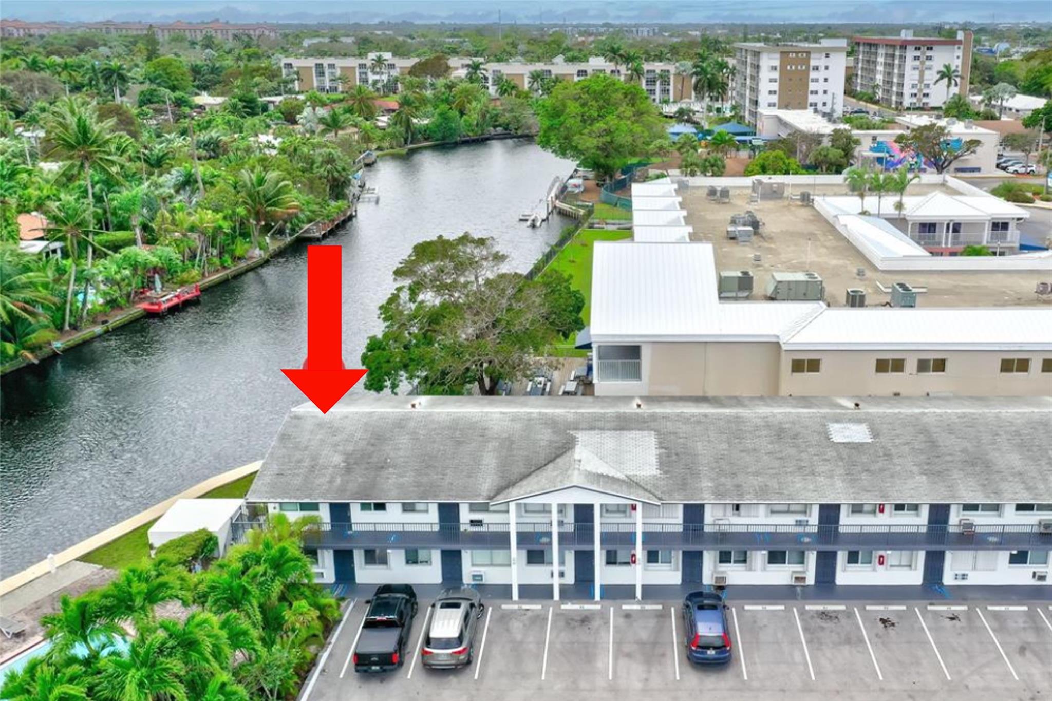 Situated directly on the wide portion of the Middle River, this corner unit offers unparalleled panoramic views of the canal, beautiful neighborhood and pool area that will take your breath away. Enjoy peace of mind with hurricane impact windows and entrance door, and newly installed air conditioning units. Dive into relaxation with a swimming pool right off the water, creating a serene oasis. Perfect for unwinding alone or entertaining with friends. Conveniently located in the heart of Broward Co. This prime location grants easy access to the beach & Wilton Manors. Target, Publix and nearly every shopping destination you can think of within minutes! Great nearby restaurants too! Assigned parking #58 directly in front of unit. Pets are welcome with restrictions. LOVE WHERE YOU LIVE!