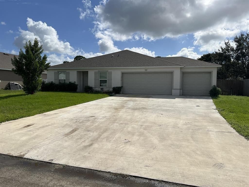 Photo of 1714 SW Haylake Avenue, Port Saint Lucie, FL 34953 (MLS # F10542581)