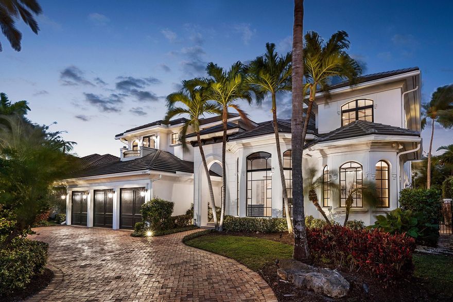 raised spa, and covered patio in a lush tropical setting.