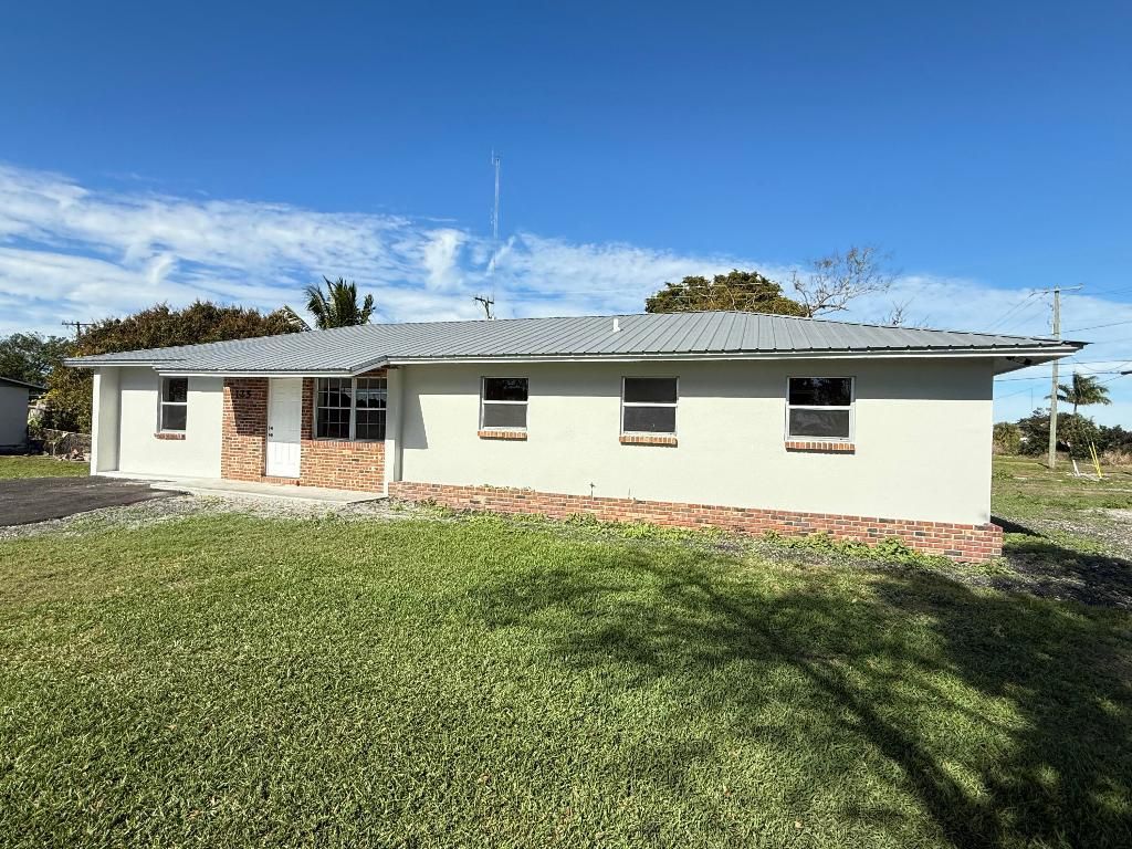 Photo of 125 SE Avenue M, Belle Glade, FL 33430 (MLS # R11150582)