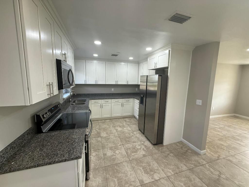 Photo of 125 SE Avenue M, Belle Glade, FL 33430 (MLS # R11150582)