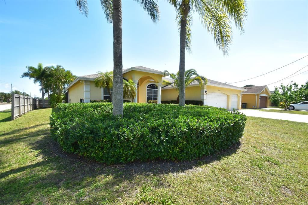 Photo of 2371 SE Leithgow Street, Port Saint Lucie, FL 34952 (MLS # R10700455)