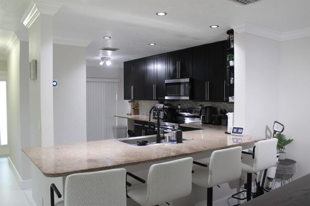 Photo of 3001 NW 48th Avenue, Coconut Creek, FL 33063 (MLS # B26024459)