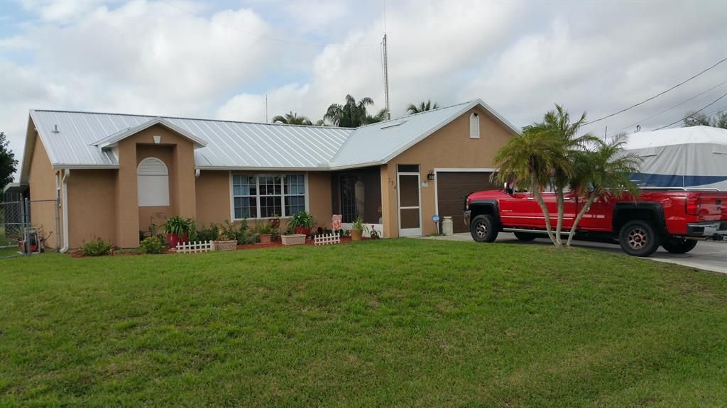 Photo of 734 SW College Park Road, Port Saint Lucie, FL 34953 (MLS # R10696390)