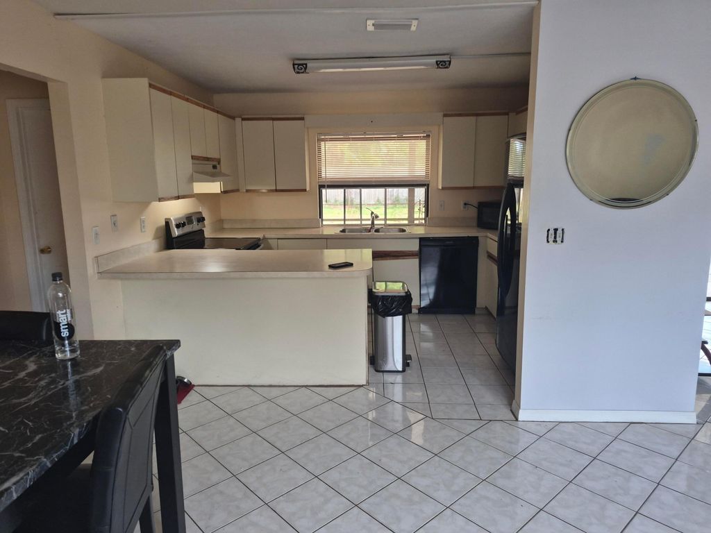 Photo of 250 SE Walters Terrace, Port Saint Lucie, FL 34983 (MLS # R11146006)