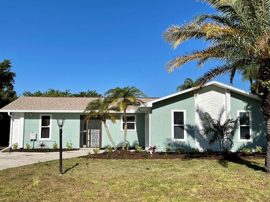 Photo of 718 NE Emerson Street, Port Saint Lucie, FL 34983 (MLS # R10719924)