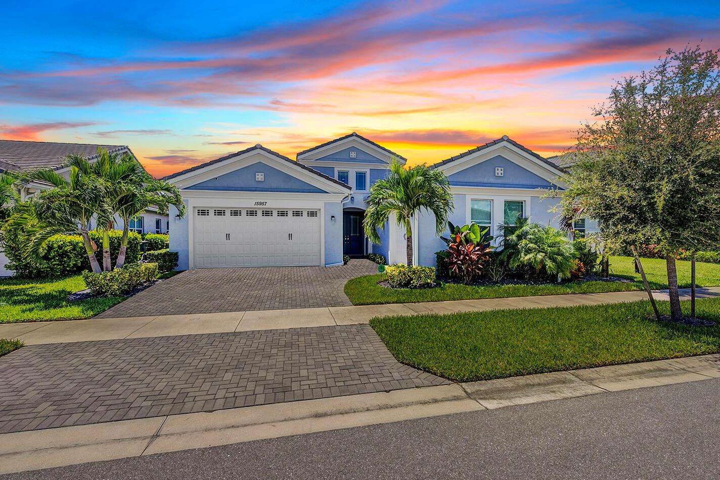 Welcome to this immaculate 3 bedroom plus den, 3 bathroom home featuring a 3 car garage and an ideal open concept layout. Built in 2022 with full impact glass and automatic window treatments, this home offers modern finishes, high ceilings and abundant natural light. The chef's kitchen boasts premium cabinetry and quartz countertops perfect for entertaining. The split bedroom floor plan ensures privacy, while the versatile den is ideal for a home office or guest space. Step outside to your private screened in patio with a heated pool overlooking the tranquil lake. Located in a secure gated community with resort style amenities, this home combines elegance, comfort and peace of mind.