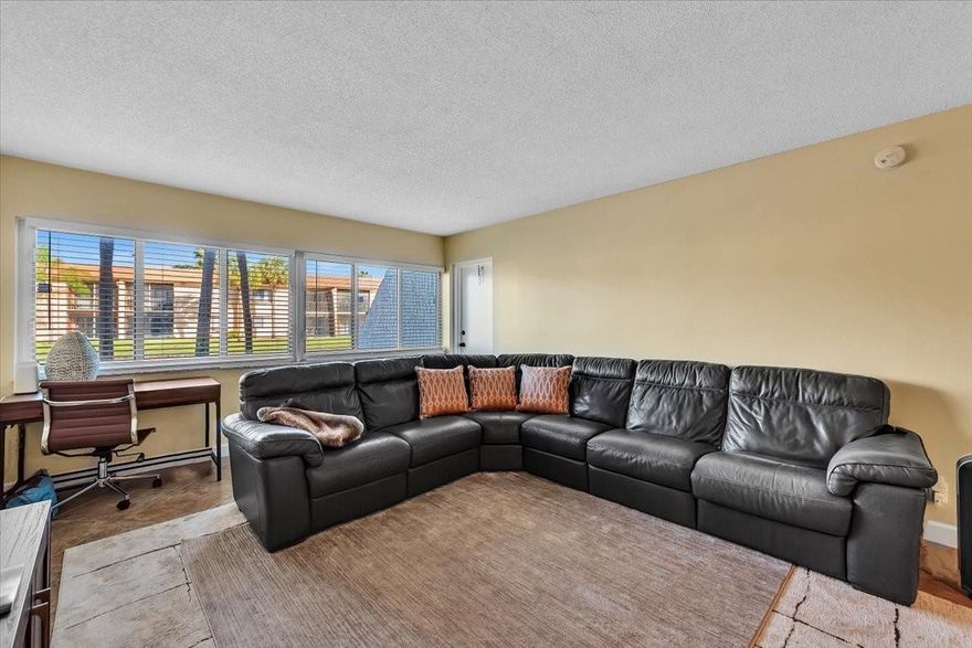 Gorgeous lake views from this well-maintained ground-floor unit with immediate rental eligibility. Features inc. Impact Windows, modern kitchen w/ granite countertops, neutral tile backsplash, S/S appliances, & a convenient pass-through to the dining area. Ceramic tile flooring throughout, new 2-ton A/C (2024), updated electrical panel, and new building roof (2023). Enjoy a full-size stackable washer and dryer in the unit. Corporate and Pet Friendly.  2 pets (20 lb max). Low monthly fee. 1 assigned parking space. Owners pay an annual Township fee ($420) granting access to resort-style amenities incl. fitness center, pickleball/tennis courts, basketball, bowling, theater/ballroom, billiards, indoor racquetball, kids club, & more. Bonaventure Country Club nearby for golf enthusiasts.