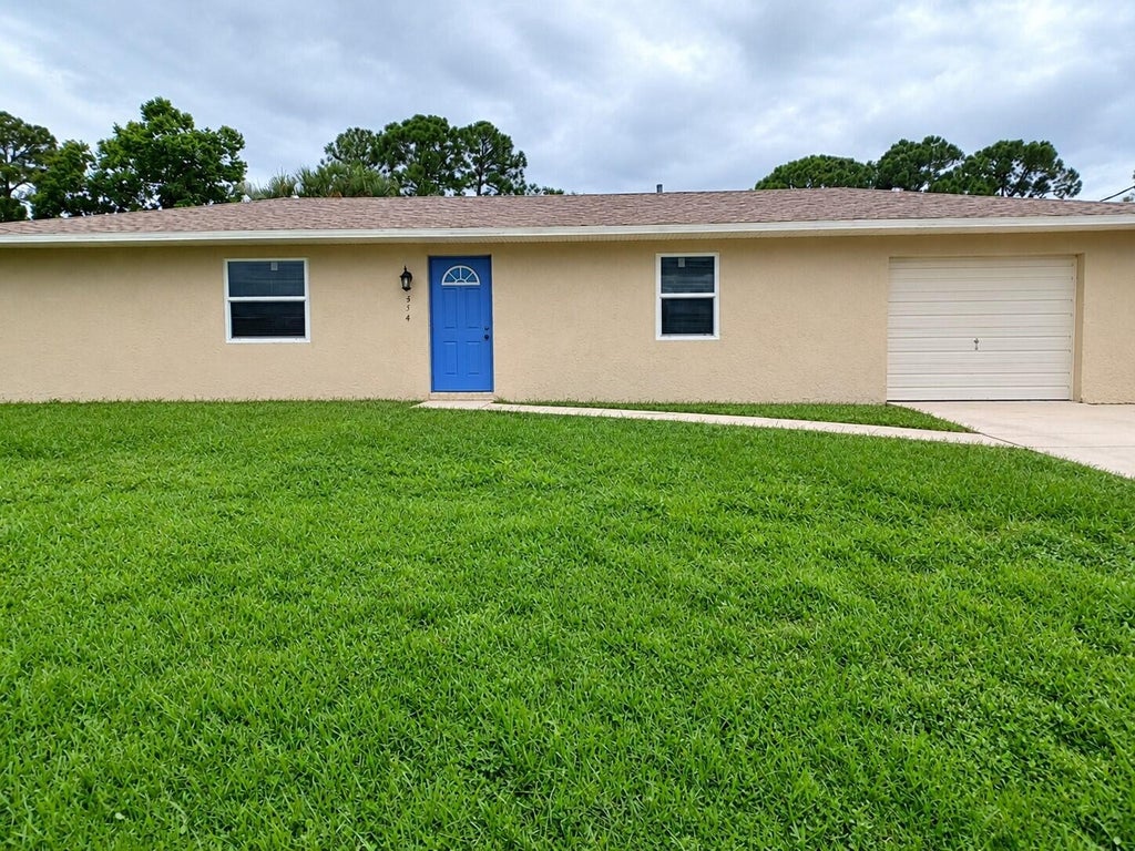 Photo of 314 SE Evergreen Terrace, Port Saint Lucie, FL 34983 (MLS # B26078949)