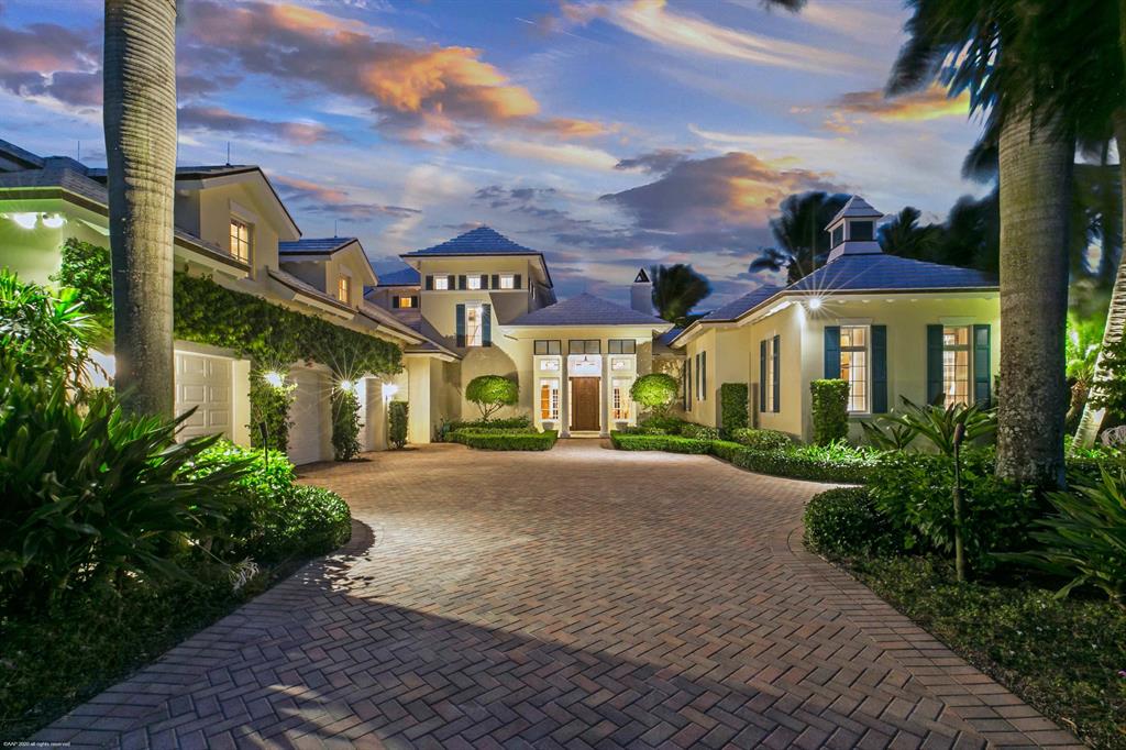British West Indies masterpiece situated on the Loxahatchee River in the premier neighborhood of The Estates of Pennock Point. Nestled on a 1.3+ acre, riverfront home site with 150' of waterfrontage overlooking the widest part of the river and Jupiter Lighthouse, this home was built in 2009 by Davis Construction, a Palm Beach high-end builder. Its spacious layout offers 5 bedrooms and 2 den/office rooms, 5 full baths plus 3 half baths, and a 3-car garage. Features of this impeccably detail-oriented home include: custom ceilings throughout; formal living & dining rooms; spacious family room with gas fireplace & built-in entertainment center; chef's kitchen with two large prep islands, custom cabinetry & top-of-the-line stainless steel appliances; wet-bar; impact glass throughout; and, an