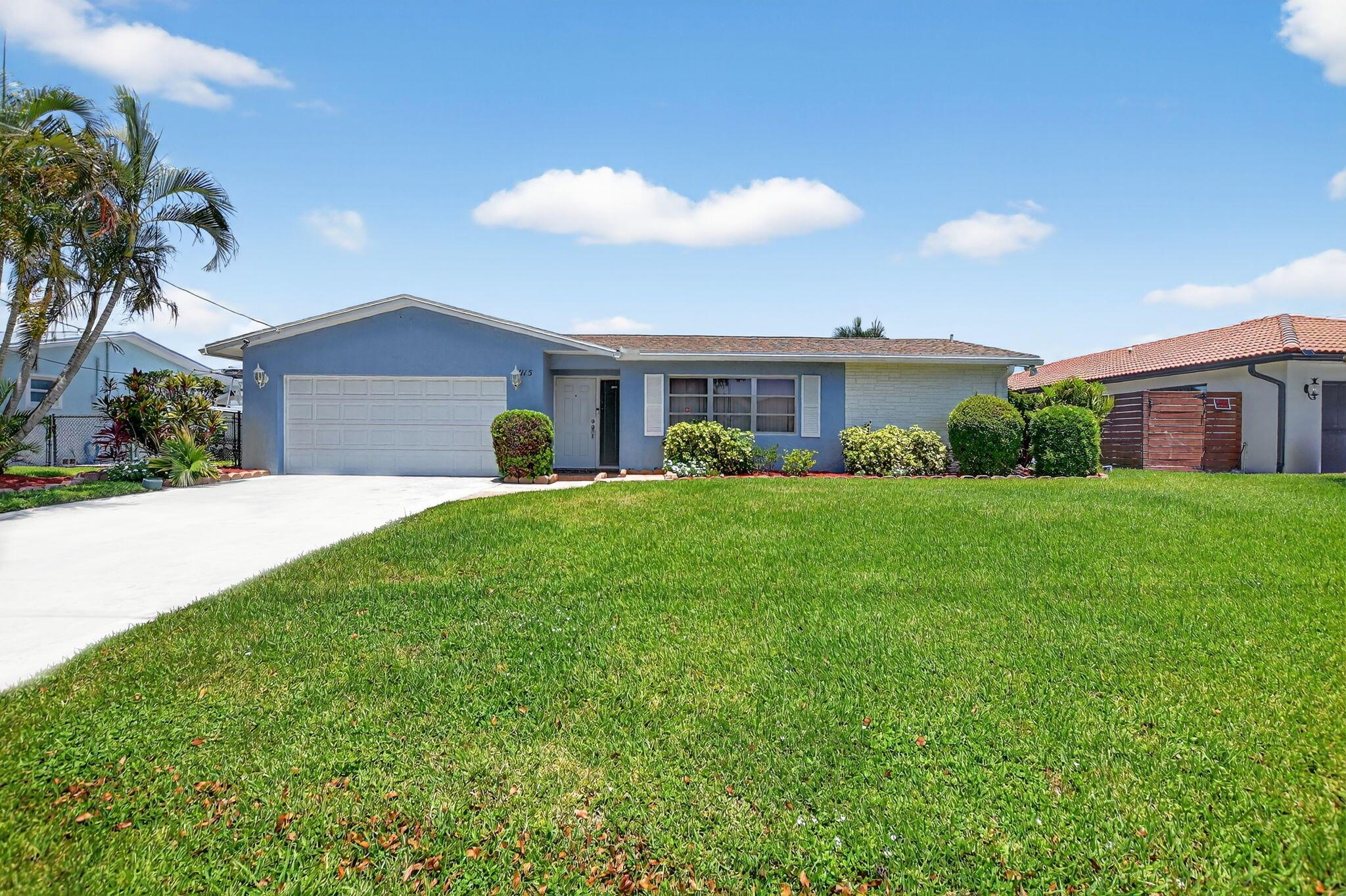 Waterfront living with no HOA in sought-after Golfview Harbour! Embrace the ultimate South Florida lifestyle in this beautifully maintained 3-bedroom, 2-bath waterfront home with DOCK located in the highly desirable community of Golfview Harbour. Perfectly situated on a navigable freshwater canal with access to Lake Ida, Lake Osborne, and an extensive network of waterways, this property is a paradise for boating, fishing, and jet ski enthusiasts. Whether you're casting a line or enjoying a sunset cruise, your backyard becomes a gateway to adventure. Step inside to discover a thoughtfully designed split-bedroom floor plan offering both functionality and privacy. The light-filled interior features neutral tile flooring throughout, plantation shutters, and generous living spaces including a