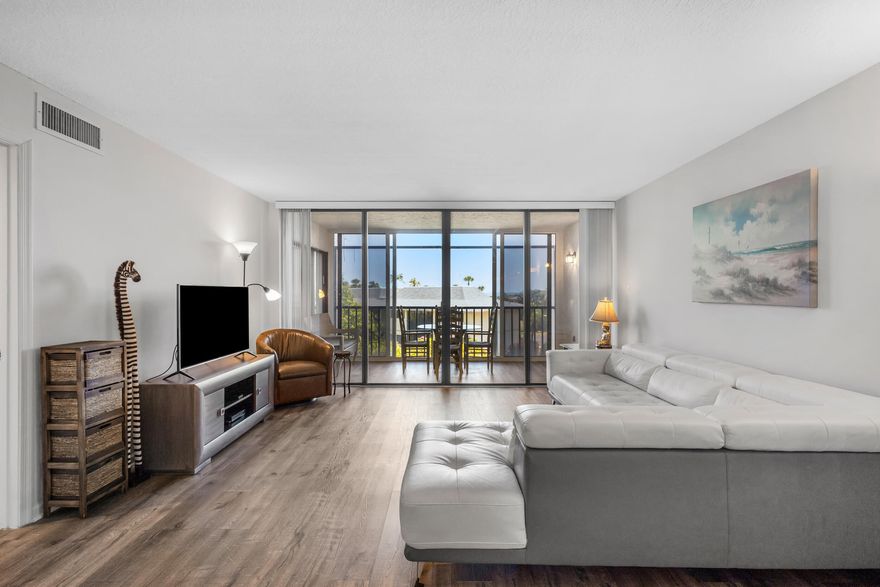 Beautifully updated 2 bedroom condo with a peak of ocean views located in Ocean Village, a gated community set along 3000 ft of unspoiled beach. Luxury Vinyl floors throughout, stainless steel appliances, new custom cabinets and granite countertops. Updated bathrooms with high end fixtures and finishes. Breathtaking sunrises from the screened in patio while enjoying your morning coffee. Conveniently located to all amenities, ocean front restaurant and tiki bar, 3 swimming pools, tennis, golf ,bocce ball, and a short stroll to the beach. Brand new club house with state of the art fitness center and coming soon, a magnificent new resort style pool located in the heart of it all.