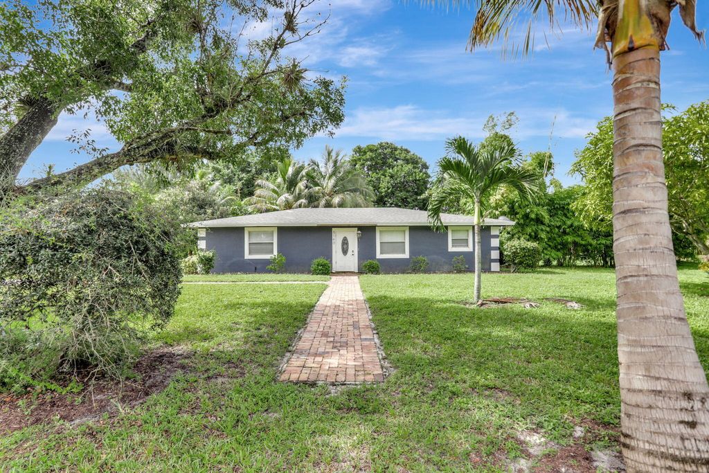 Photo of 5140 NW 76th Place, Pompano Beach, FL 33073 (MLS # R11019410)