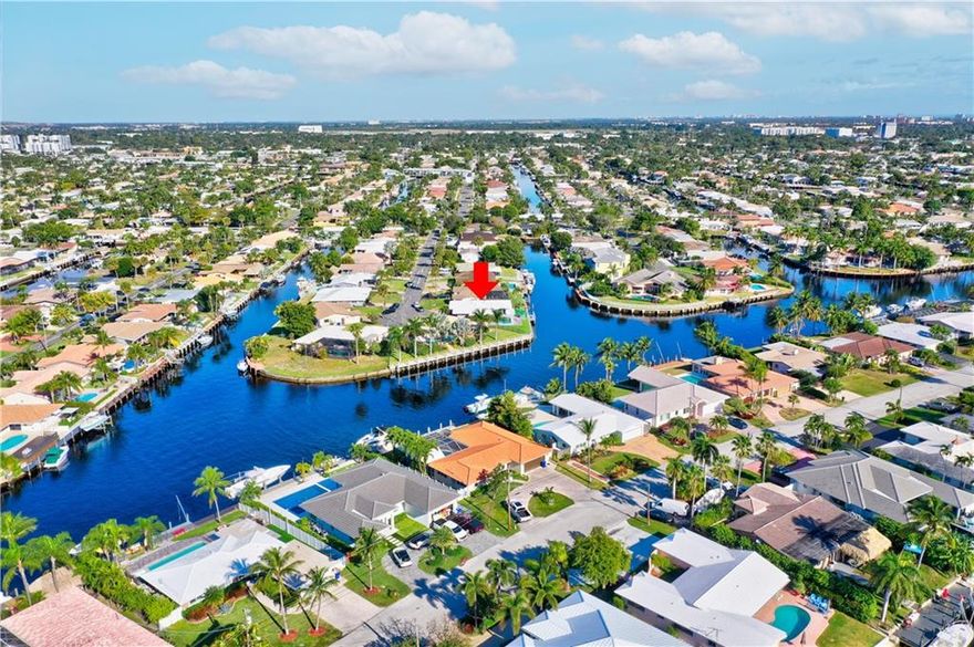 Updated 3 bedroom 3 bathroom waterfront pool home with a garage on a wide canal in Cypress Lake Estates.  110 feet of waterfrontage with beautiful wide water views and only the Federal Highway bridge.  Open kitchen with quartz countertops and stainless steel appliances.  New flooring throughout, new roof 2020.  Interior laundry room.  Updated electrical and plumbing, new ac.  Almost 2000 square feet under air.  Seperate family room and living room.  Tropical outdoor area perfect for entertaining.  Enjoy the canal views with eastern exposure.  3 full bathrooms completely updated, one cabana bath, master has separate tub and shower.  3 sliders that open to the pool area.