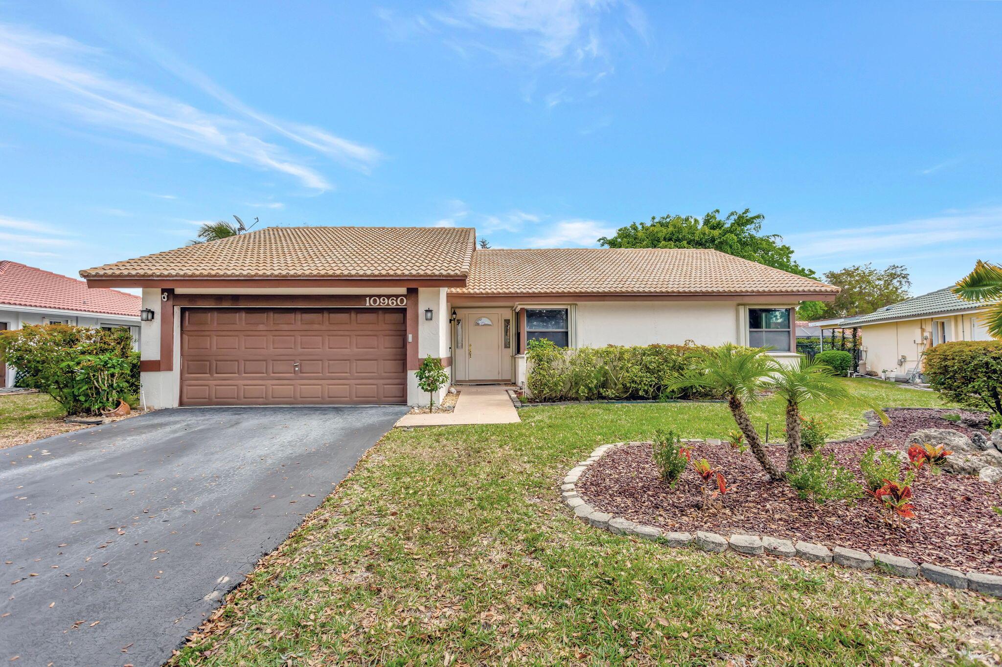 Welcome to this beautifully maintained pool home in the heart of Coral Springs! Situated on a spacious 10,000+ sq ft lot with no HOA. This inviting home offers a desirable open floor plan featuring soaring wood-accent ceilings in the living area and an abundance of natural light throughout. Enjoy Florida living at its best with a screened-in pool, ideal for entertaining family and friends. The interior boasts neutral tile flooring in main living spaces, laminate floors in the bedrooms, and a stylish kitchen complete with stainless steel appliances. Recent updates include a 1 yr old AC, full accordion shutters, and new pool/ sprinkler motors. Formal dining can easily be converted into 4th bedroom/ office. You will not want to miss the opportunity to call this home.