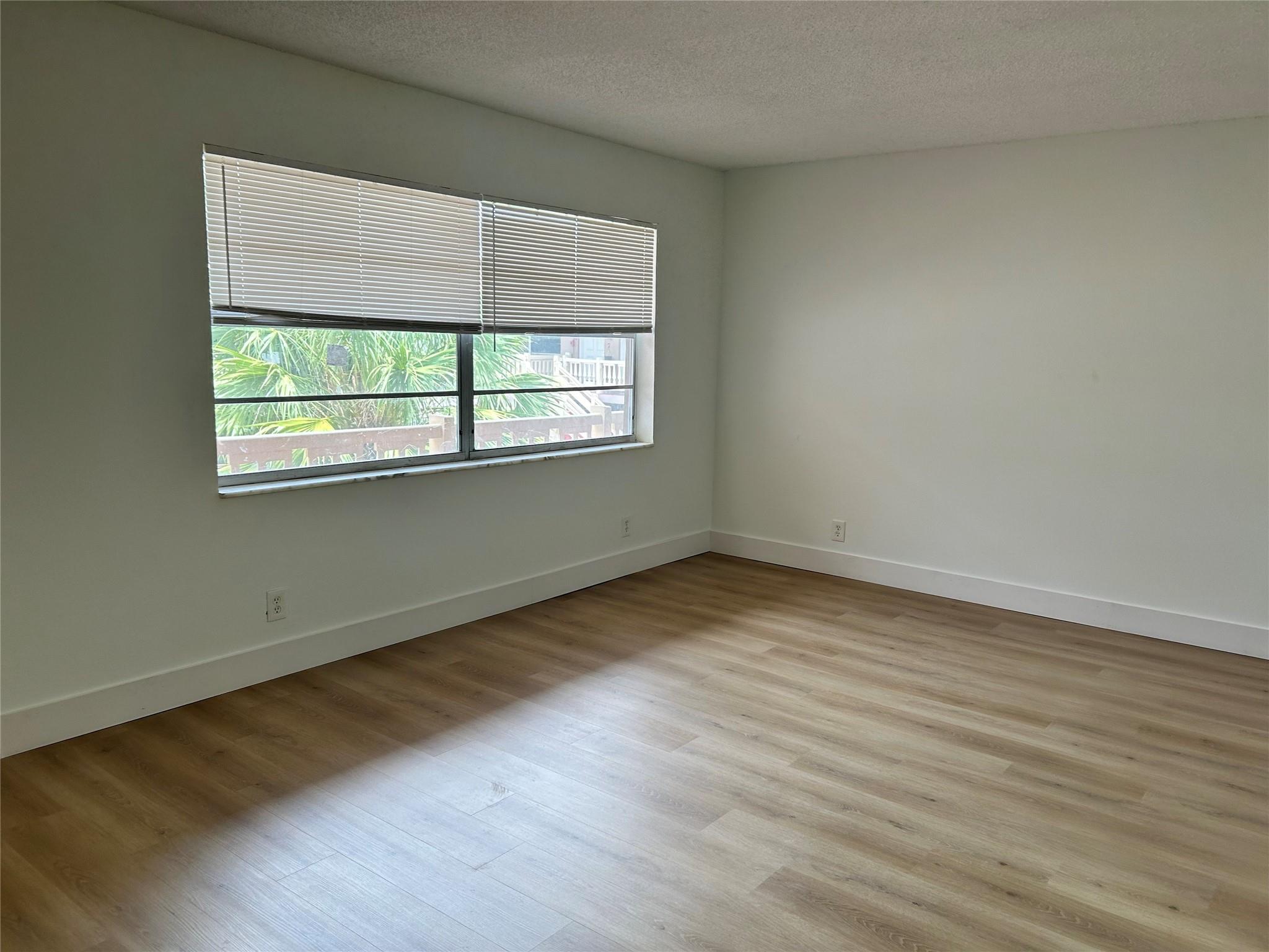 Located in the heart of Pompano Beach, this charming 2-bedroom, 2-bathroom apartment is the epitome of modern convenience and comfort. As you step inside, you'll be greeted by the warm, inviting tones of new vinyl flooring that extends throughout the entire unit, providing both durability and a sleek, contemporary look. Both bedrooms are generously sized, offering plenty of space for furniture and personal touches. The master bedroom features an en-suite bathroom. The apartment building includes a dedicated laundry room, and a beautifully maintained community pool to enjoy all year long. Close to everything Pompano Beach has to offer, this apartment places you within easy reach of shopping centers, restaurants, entertainment venues, and the stunning coastline.