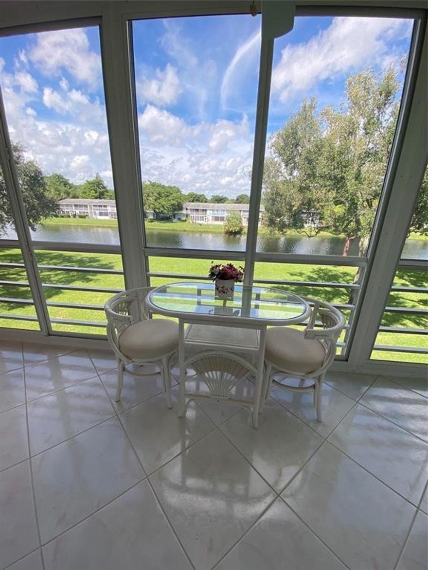 UPDATED, 1/1.5 WITH WATER VIEW IN PRIME WESTBURY AREA! Sold furnished. 785 sq.' condo with galley kitchen that boasts granite counter tops, recessed lighting. White and stainless steel appliances including a dishwasher. A/C is 2022 with permit, tile flooring except in primary bedroom which has carpeting. Updated bathrooms, extra storage on enclosed patio with floor to ceiling sliders, and tranquil water view from your bistro set. Close to Westbury pool, plaza and main gate at Hillsboro Blvd. Building boasts 3 common area patios on the water for an early evening spirit or meal. PROOF OF FUNDS AND FICO SCORE TO BE PROVIDED WITH ALL OFFERS.