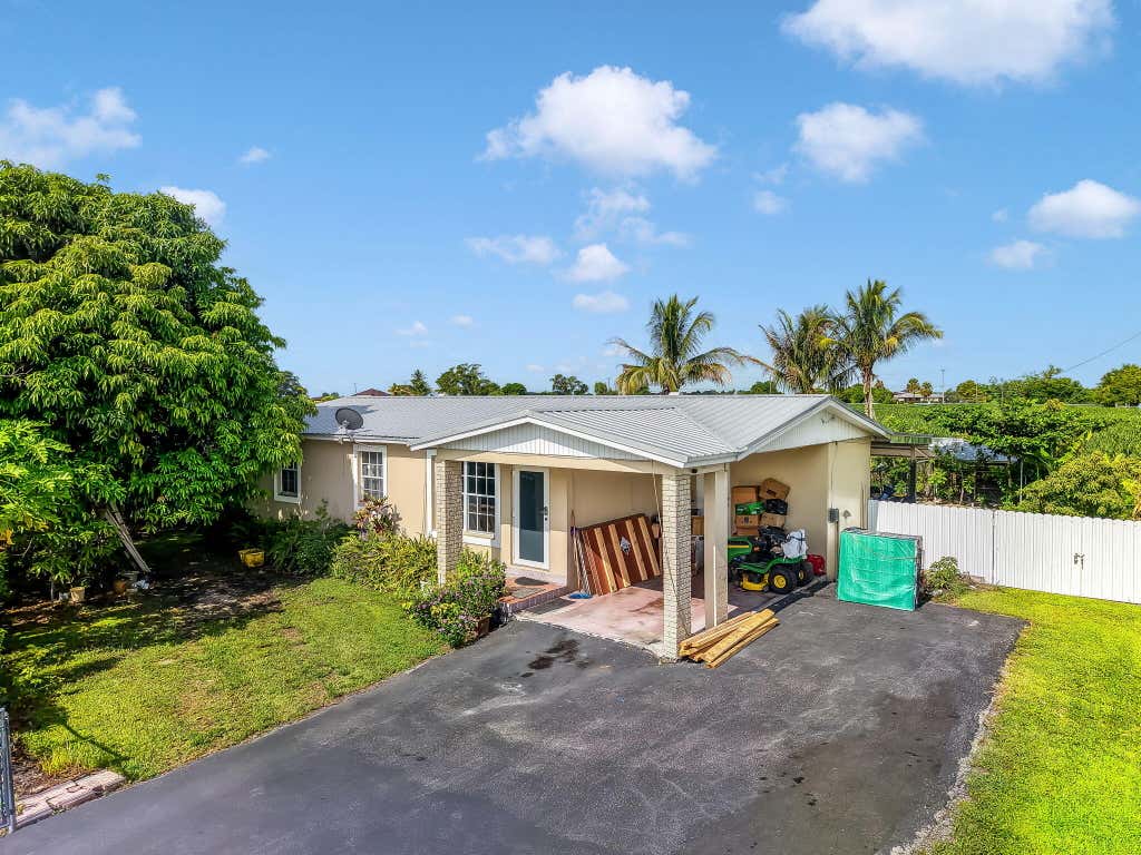 Photo of 1048 WHITAKER Road, Belle Glade, FL 33430 (MLS # B26059197)