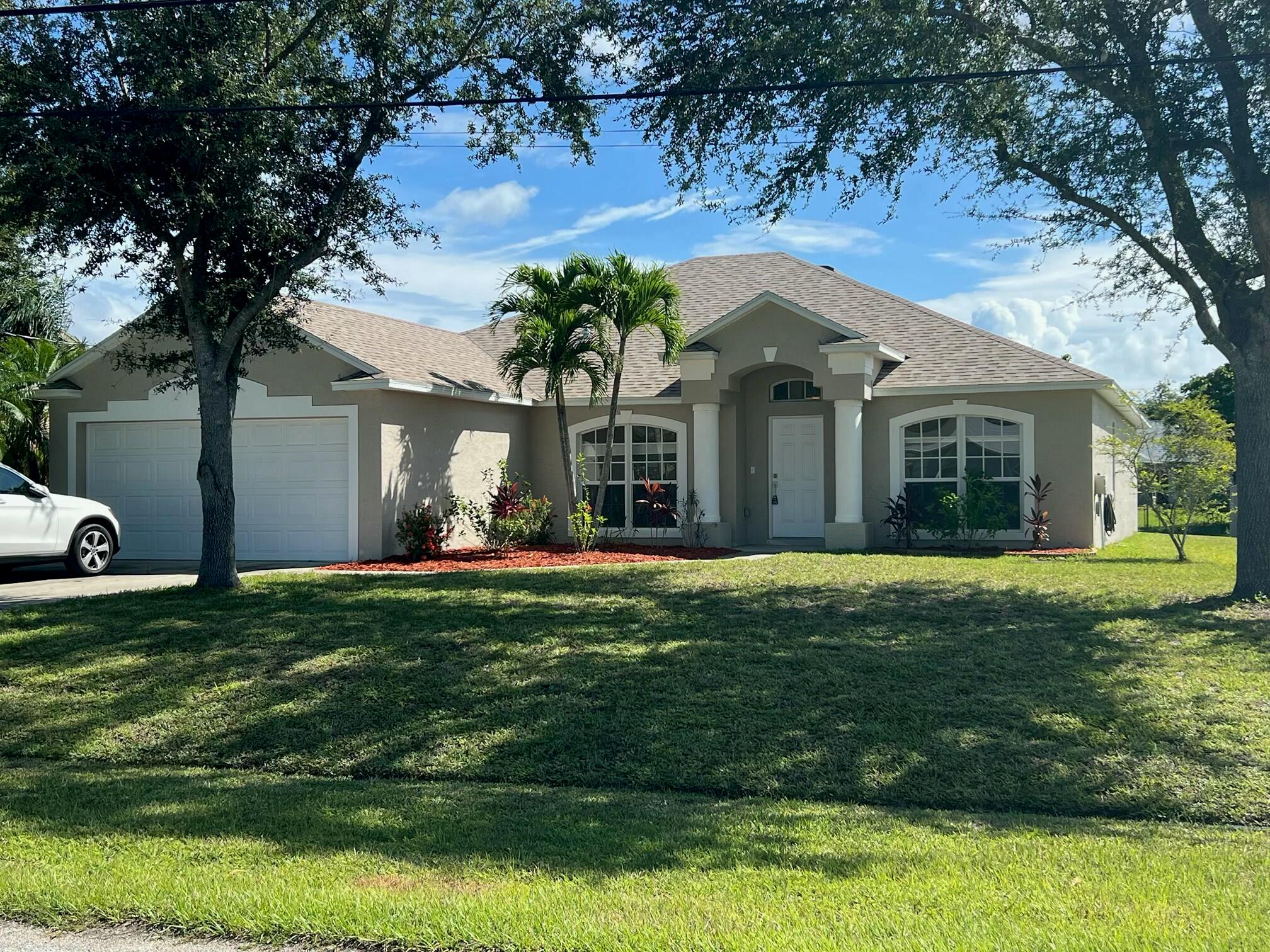 Welcome to 518 SE Nome Drive in the South Bend neighborhood of Port St. Lucie. This 2005 build CBS block with Stucco overlay home offers a Brand New Roof with transferrable Warranty, 2078 square feet under air, including 4 bedrooms and 2 full baths on a split floor plan with ceramic tile throughout. An inside the house laundry room and large 2 car garage with a finished floor as well. The large backyard would fit a pool and then some. All this and move in ready, the only thing it needs is you.