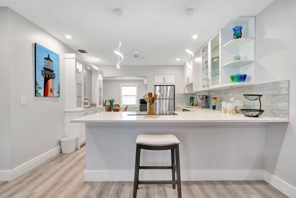 Photo of 1125 Stillwater Drive, Jupiter, FL 33458 (MLS # B26083050)