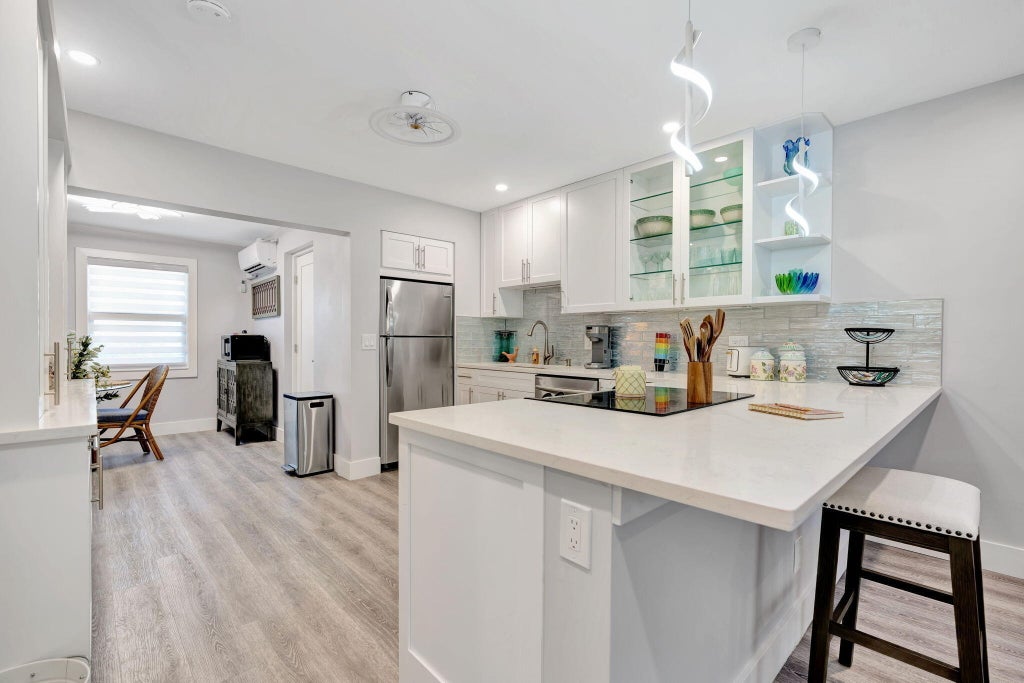 Photo of 1125 Stillwater Drive, Jupiter, FL 33458 (MLS # B26083050)