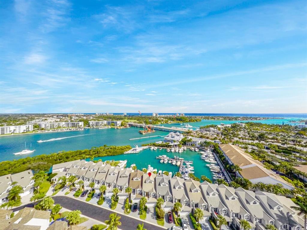 Attention Boaters!! Back on the market with a 45' boat slip. Welcome home to one of the most desirable waterfront communities in Jupiter in this newly renovated townhome in Jupiter Harbour featured in the Wall Street Journal for its' amazing salt water aquarium. This home is in a prime location at the Jupiter inlet - perfect for boating as you can walk off your patio right on to the docks. Enjoy spectacular water views, views of Jupiter Lighthouse and walking distance to some of the most desirable restaurants and night life along Jupiter's Riverwalk. This ultra modern home is the premier entertainment hub for music and movie lovers featuring a state of the art high end Dolby ATMOS Home Theatre system with remote powered 160'' screen , 4K projector, plus an 85''