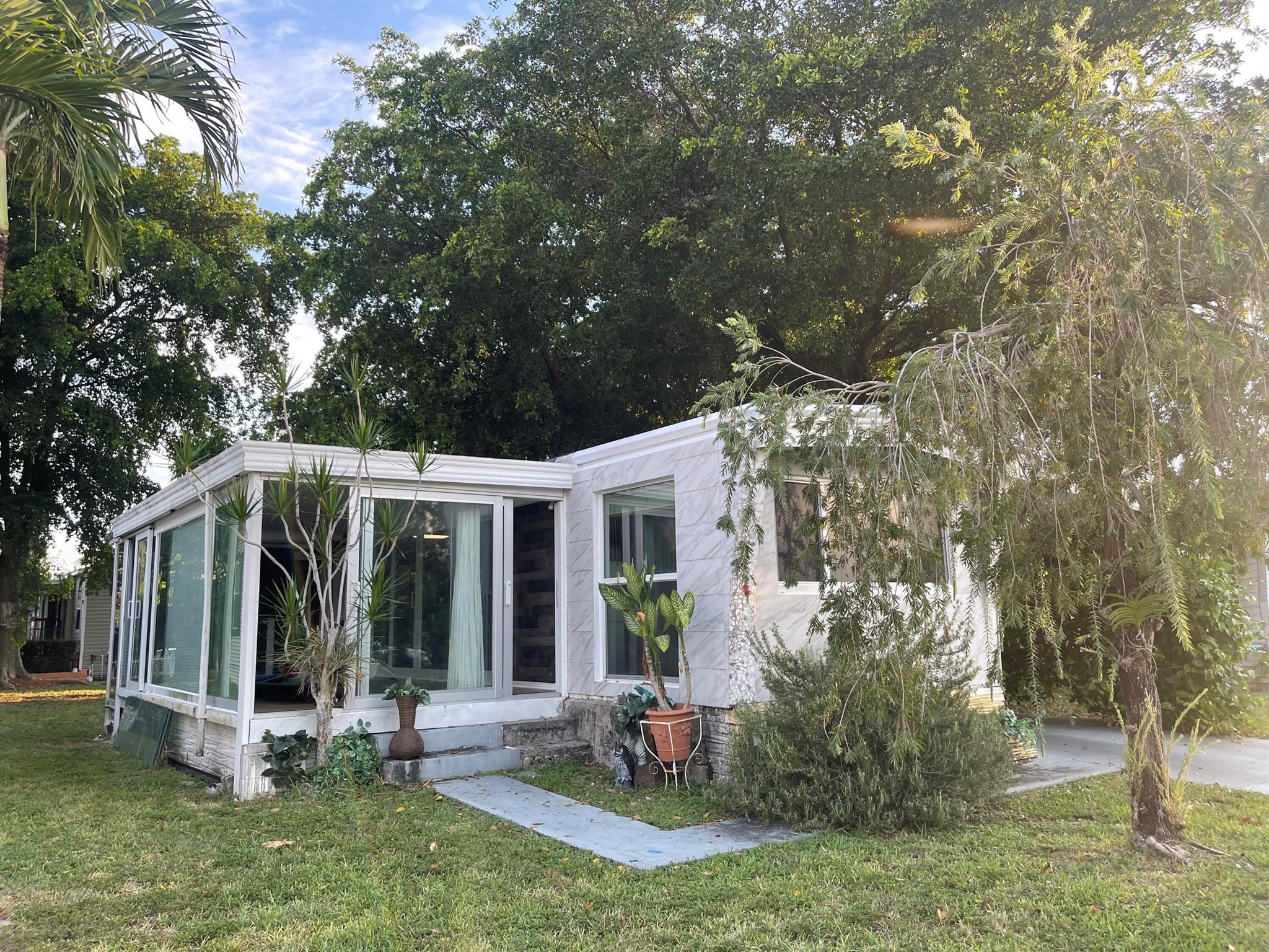TOTALLY RENOVATED ONE-STORY, SPACIOUS AND AN EXTENDED MODEL HOME IN THE SOUGHT AFTER GATED CORAL CAY COMMUNITY. GLASS IMPACT WINDOWS AND DOORS MOSTLY THROUGHOUT. IT OFFERS A BONUS GREAT ROOM WITH IMPACT SLIIDING DOORS CREATING A SENSE OF SECURITY, NOISE BARRIER & LOTS OF BRIGHTNESS! SIGNIFICANT CONCRETE PROJECTS AND EVEN THE LAUNDRY ROOM COMES WITH IMPACT IWINDOWS AS PER SELLER. A COSTUM MADE EXTERIOR DECK AREA AND A GREAT YARD! GREAT TO ENJOY BEAUTIFUL SUNSETS, BARBECUING & ENTERTAINMENT! CORAL CAY COMMUNITY OFFERS LOTS OF AMENITIES, NEAR TO LOCAL RECREATION, SHOPPING, COFFEE SHOPS,, HOSPITAL, RESTAURANTS & MANY MORE AMENITIES AND ENTERTAINMENT!! A MUST SEE! MOVE IN READY! A PLACE TO CALL HOME! PROPERTY CAN BE SOLD FURNISHED OR UNFURNISHED. .