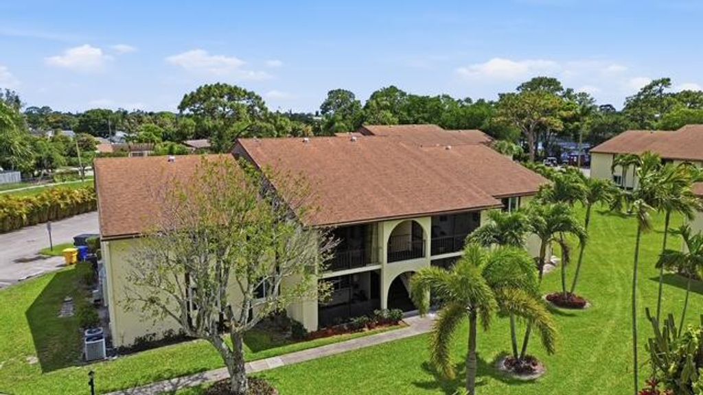 Photo of 3561 NW Tall Pine Way Way NW #C2, Greenacres, FL 33463 (MLS # B26012728)