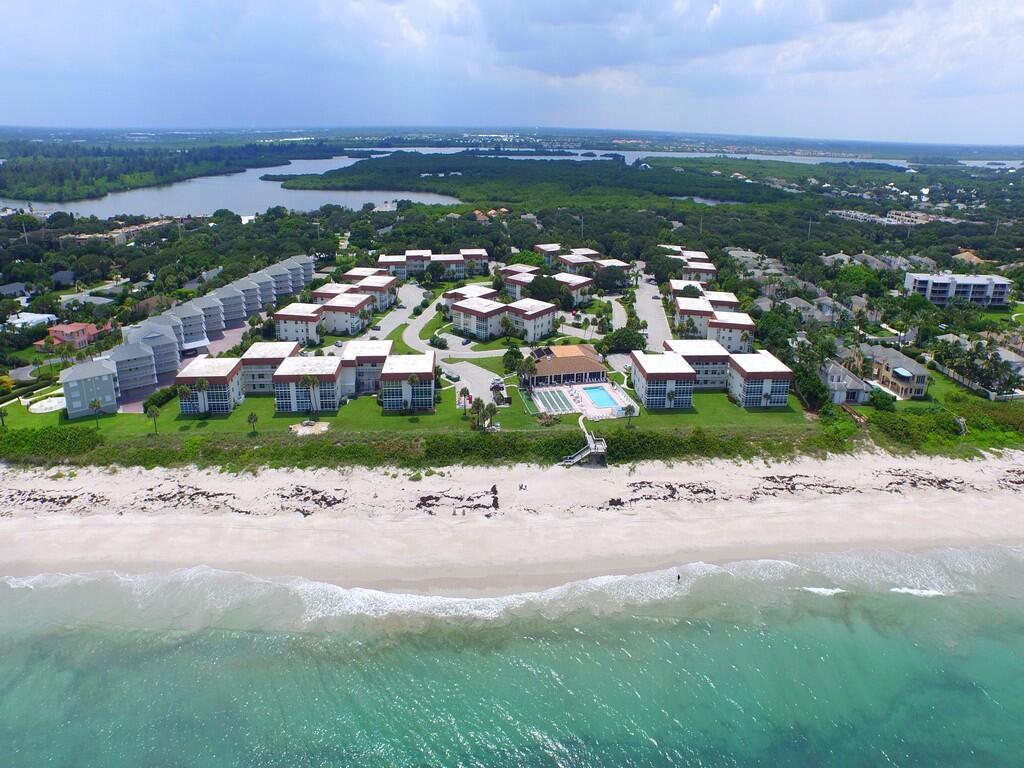 Enjoy the beach life every day in this 55+ oceanfront community! This cheerful first-floor corner unit is full of natural light and coastal charm, with impact windows, newer A/C, tile floors, fresh bathrooms, and a comfy air-conditioned sun porch. The LOW HOA gives you access to a clubhouse, heated pool with ocean views, shuffleboard, fitness room, gas grills, and an on-site manager. Best of all--you're just steps from the sand! Call today to schedule your private tour & come start living your best beach life!