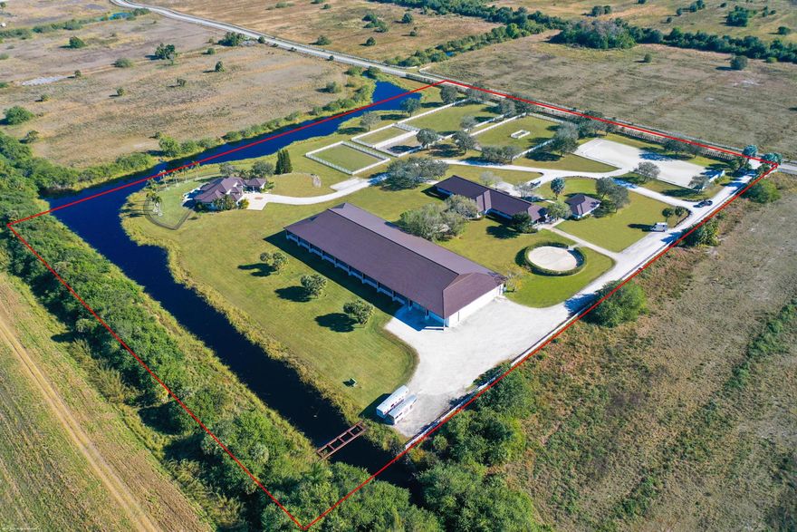 Updated in 2023, this 14.63-acre farm with 20-stall center-aisle barn has 2 tack rooms, a covered patio overlooking the 100' X 213' covered riding arena with GGT footing, mirrors & observation platform. There is also an outdoor riding arena with mirrors and new gazebo. Other features include: a round pen, a 51' X 86' storage garage, detached staff house with two apartments with 4-bedrooms total. The owner's residence has 4-bedrooms plus an office, private pool & fenced backyard with water views. The home was completely updated from top to bottom in 2023. The kitchen boasts double islands with waterfall edge quartz counters and oversized walk-in pantry. This equestrian estate offers everything a serious equestrian could desire!