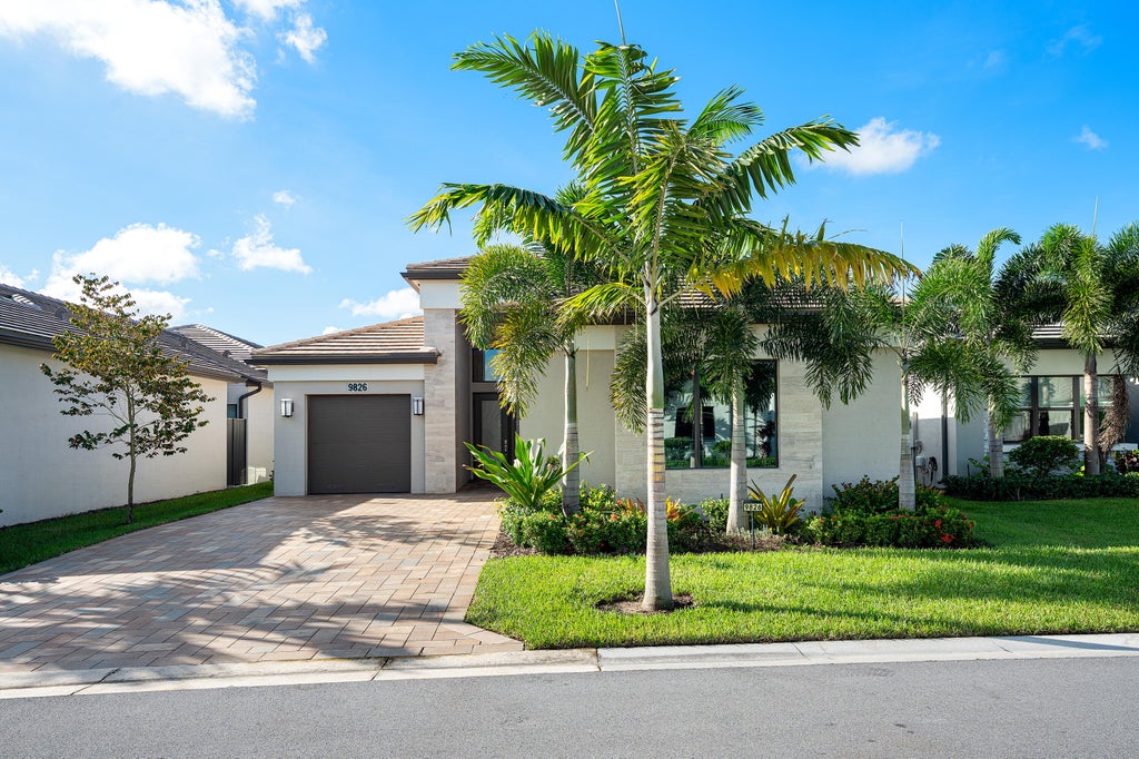 Photo of 9826 Turning Bluff Lane, Boynton Beach, FL 33473 (MLS # B26085767)