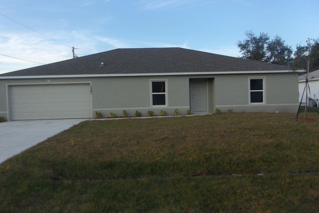 Photo of 1081 SW Spataro Avenue, Port Saint Lucie, FL 34953 (MLS # R10979797)
