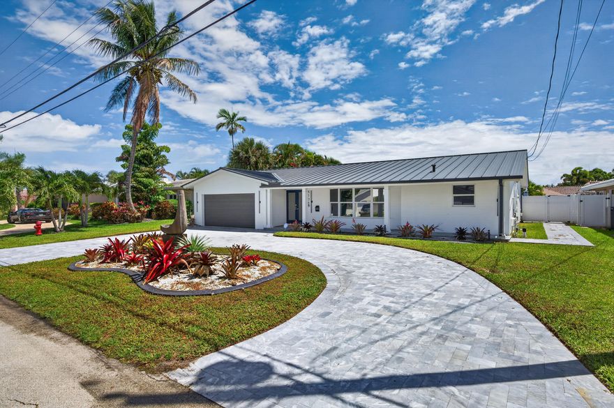 Experience waterfront living in this beautifully updated 4-bedroom home on a quiet canal with direct ocean access and just minutes to the Intracoastal. Features include impact windows and doors, a 3-year-old roof, and two updated A/C units. The modern kitchen offers elegant cabinetry and quartz countertops, perfect for everyday living and entertaining. Enjoy a private outdoor retreat with a marble-paved patio and sparkling pool. Boating is easy with a new seawall and boat lift. Circular paved driveway adds curb appeal and convenience. In addition, as a bonus, all furniture included. Prime Fort Lauderdale location.