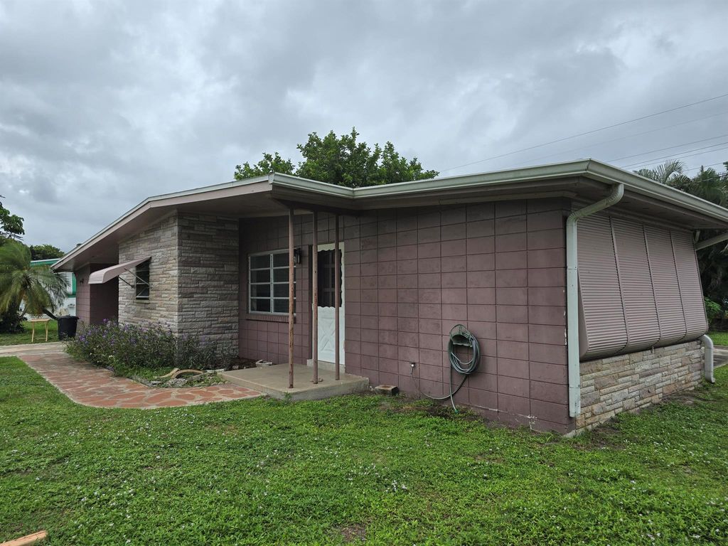 Photo of 107 E Arbor Avenue, Port Saint Lucie, FL 34952 (MLS # R11121984)