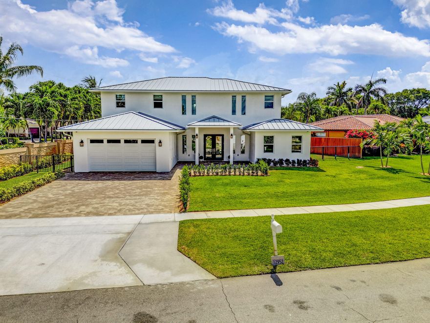 Welcome to this exceptional new construction residence in the highly sought-after community of Juno Isles. PRICED BELOW APPRAISAL VALUE, A RARE OPPORTUNITY TO WALK INTO IMMEDIATE EQUITY. This stunning 4,700 sq. ft., two-level CBS-built home seamlessly blends modern luxury with timeless elegance. With pricing set below the appraised value, buyers are stepping into built-in equity from day one, making this not only an incredible home but also a smart investment. Step inside to an expansive open floor plan, perfect for both entertaining and everyday living, featuring lush green space and meticulously designed landscaping. Enjoy the Florida lifestyle with walking distance to the beach and easy access to scenic waterways, premier shopping, dining, and a vibrant calendar of community events. This home is thoughtfully appointed with an array of high-end features, including a durable aluminum metal roof, impact-rated CGI windows, and top-of-the-line Carrier AC units for year-round comfort. The whole house audio system and central vacuum add convenience and sophistication. The gourmet kitchen boasts KitchenAid appliances, Maple Coventry cabinetry, a walk-in pantry, and exquisite top-of-the-line plumbing fixtures. Wine enthusiasts will appreciate the dedicated wine cellar, perfect for entertaining guests. Opportunities like this rarely come to market, a brand-new luxury residence priced below appraisal value, offering buyers the chance to secure a premier property while walking into instant equity. Discover luxury living in a prime location, surrounded by natural beauty and all the best that Juno Isles has to offer. This is truly a rare opportunity to own a masterpiece just moments from the sand and surf.