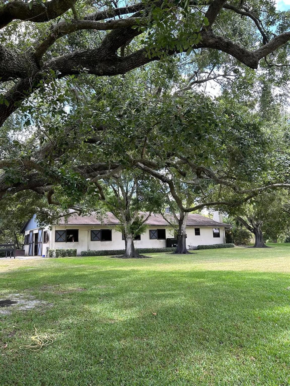 Beautiful, Peaceful 10 acre property with an 8-Stall Barn with spacious tack room.2- wash racks. 200 X 150' GGT footing arena - professionally maintained and ready for daily schooling. 7 oversized grass paddocks - ideal for turnout. Also, Grass field to ride in.Large 1-bedroom groom's apartment - fully equipped with separate living area.Additional exterior full bathroom with shower and sink - perfect for riders and guests.Spot for RV hookup. Spend the Winter on this tranquil, quiet boutique farm.🐴 The Perfect WEF Base: