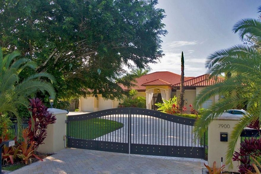 Step into this Tropical Pinecrest Oasis situated near local shops & A rated schools. Only 20 minutes from downtown and MIA. Mediterranean style, with 7 beds & 6 baths plus a luxury 1bed/1bath guesthouse next to the pool with a private entrance. Living sq footage does not include additional 1,200 sq feet of covered patio space perfect for entertaining. The main home features high ceilings, hurricane impact windows, energy efficient lighting, smart home system , 2-car garage, a large kitchen, that leads to an expansive outdoor living area. The Lagoon like style, saline pool has 2 waterfalls and a Jacuzzi for your enjoyment. This builders acre sits on a corner lot just steps away from several schools, parks and well known shops.