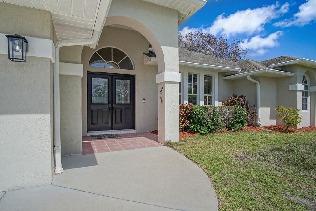 Photo of 6800 NW Hogate Circle, Port Saint Lucie, FL 34983 (MLS # B26011631)