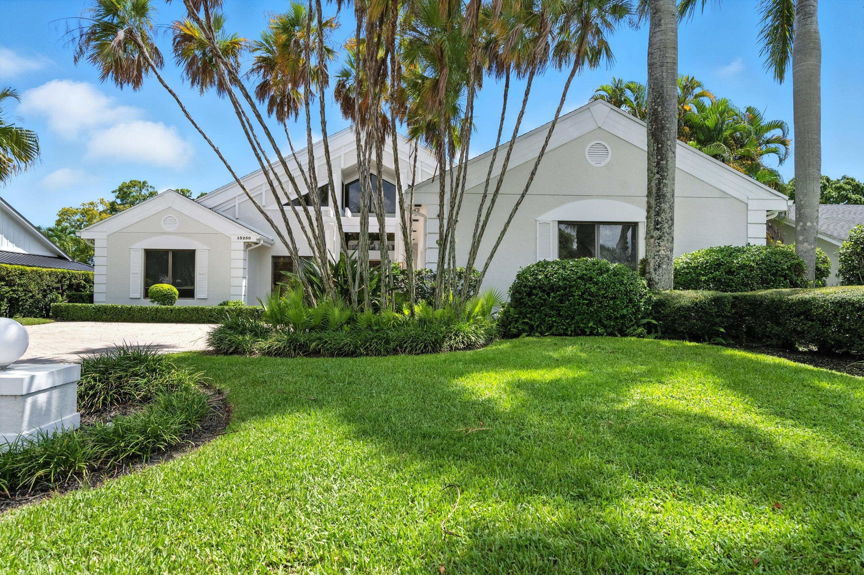 Welcome to this architectural gem in Eastpointe Country Club, featuring soaring ceilings and an abundance of natural light. Designed with entertaining in mind, the open layout features a spacious living room with bar area, modern kitchen with new appliances, and walls of glass that frame views of the private lanai and pool. Exquisite marble floors, bonus den, walk-in closets, dual sinks in both baths, and mid-century modern accents add to the home's charm and function. Recent upgrades include lush landscaping, fresh interior and exterior paint, new gutters, whole house water filtration system and three new AC units. Eastpointe is an exceptional gated community, offering two Fazio-designed championship golf courses, tennis and pickleball courts,