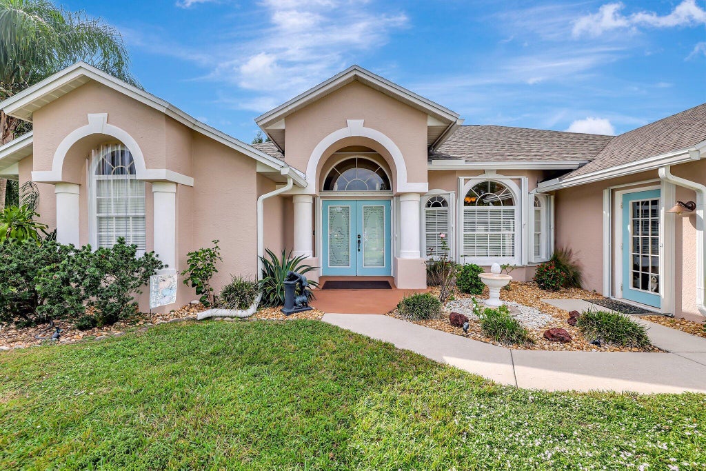 Photo of 1974 SW Oakwood Road, Port Saint Lucie, FL 34953 (MLS # R11038370)