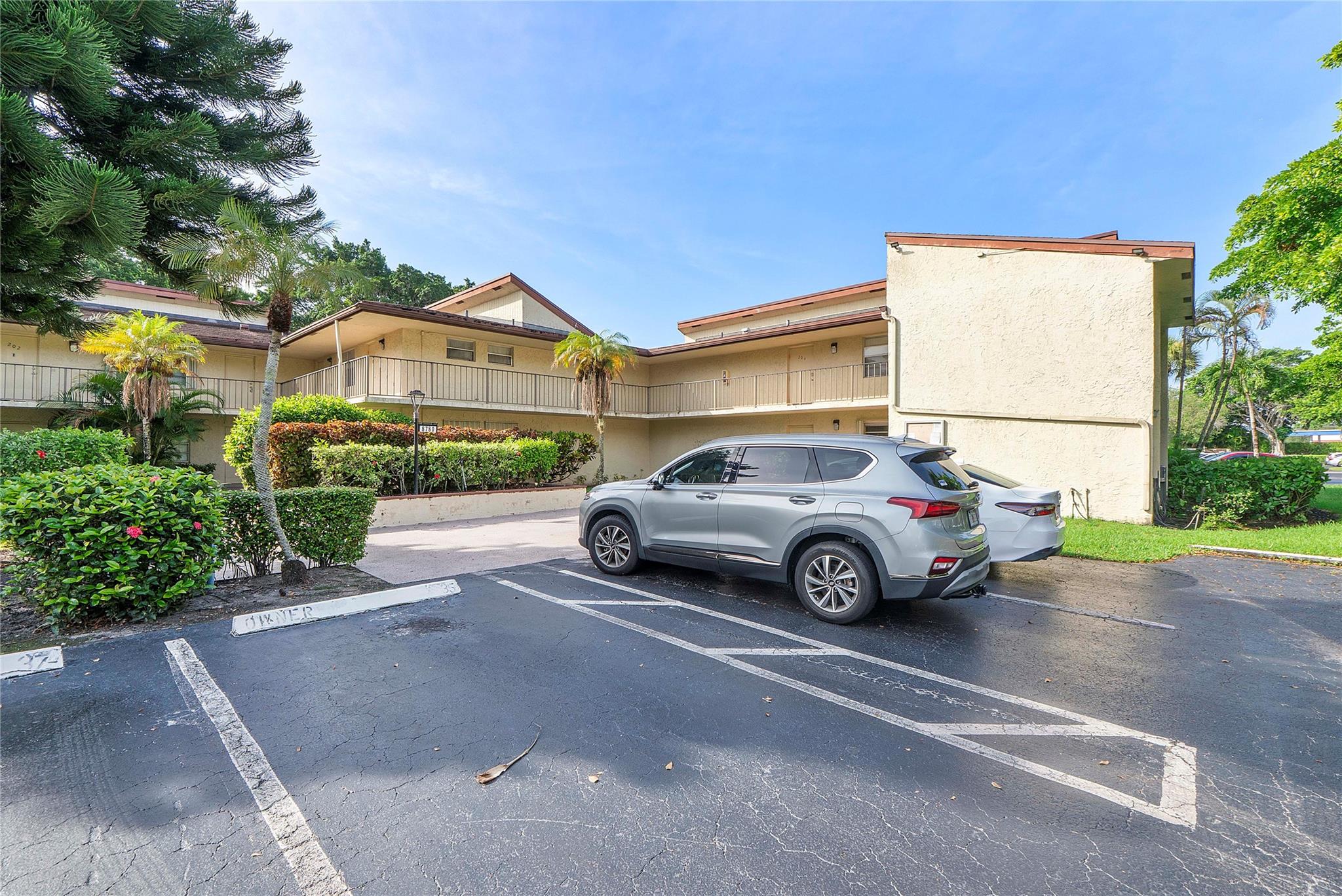 Beautifully renovated 3-bedroom, 2-bathroom corner unit in Holly Court at Woodmont offering over 1,792 sq. ft. of stylish living space. The updated kitchen boasts a custom island, granite countertops, and stainless steel appliances, opening to a spacious floor plan with tile flooring throughout—perfect for both everyday living and entertaining. The remodeled master suite features a walk-in closet and a spa-like bathroom, while the private screened-in patio overlooks serene golf course views. Accordion and roll-down shutters provide added security and peace of mind. A rare gem in Woodmont. Seller is open to all offers. Schedule your showing today!