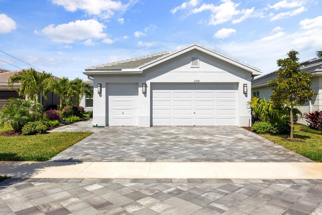 Photo of 11958 SW Coral Cove Parkway, Port Saint Lucie, FL 34987 (MLS # R10977079)